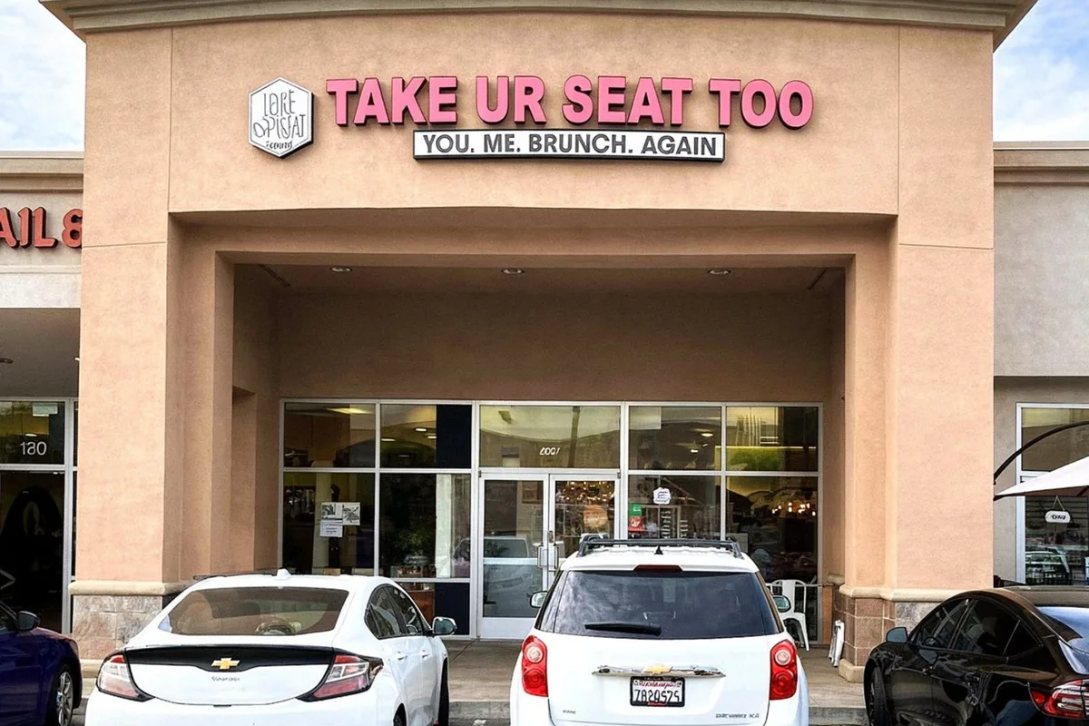 Exterior of Take Ur Seat Too in Ontario, California, with the 'You. Me. Brunch. Again.' sign above the entrance.